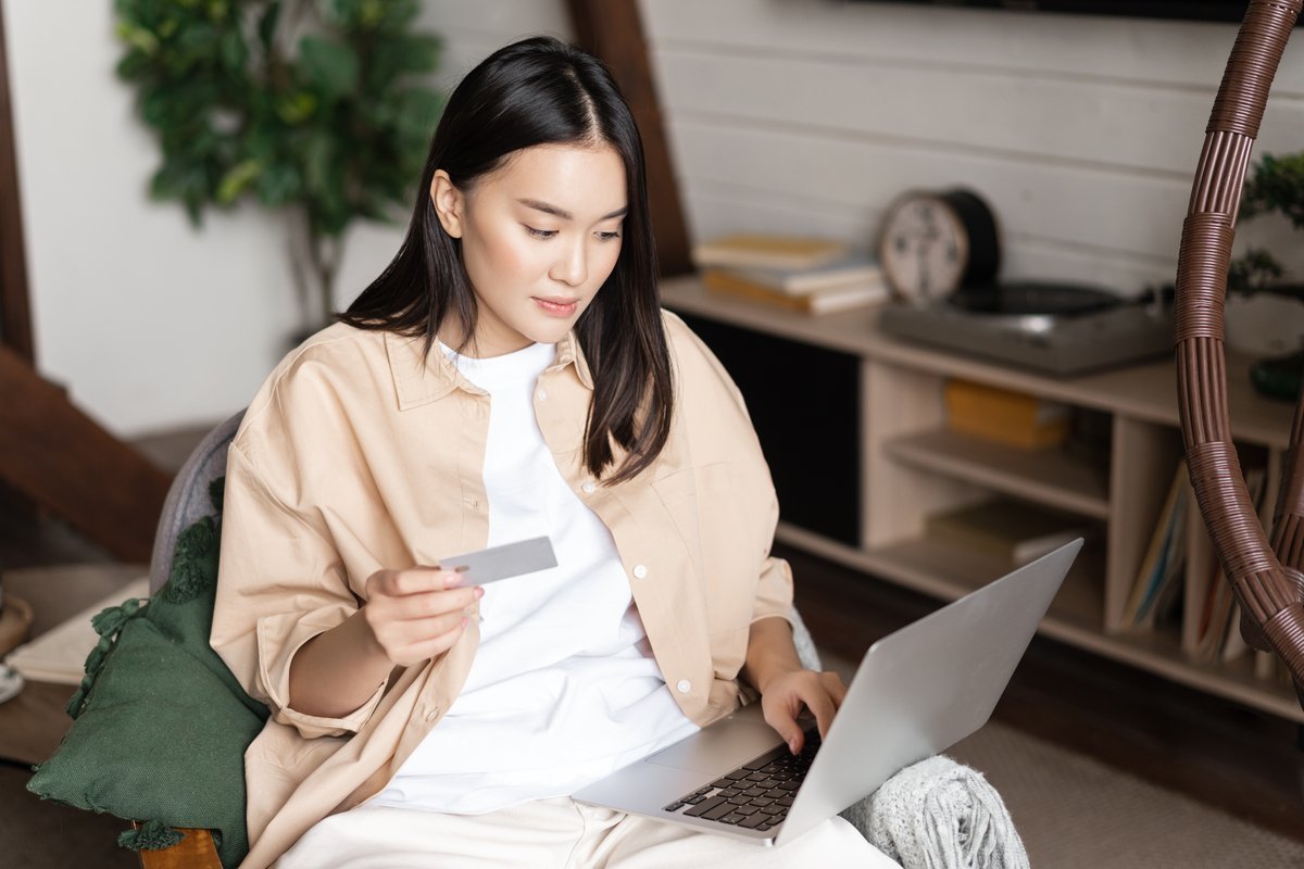 Arcadia resident reviewing laptop and financial records — home data backup and cybersecurity in the San Gabriel Valley